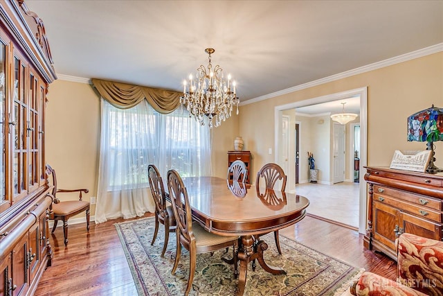 4 Hollis Rd, East Brunswick, NJ 08816 - dining area featuring a chandelier, ornamental molding, and light wood finished floors