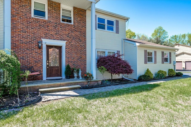 4 Hollis Rd, East Brunswick, NJ 08816 - view of front facade featuring a front yard and brick siding