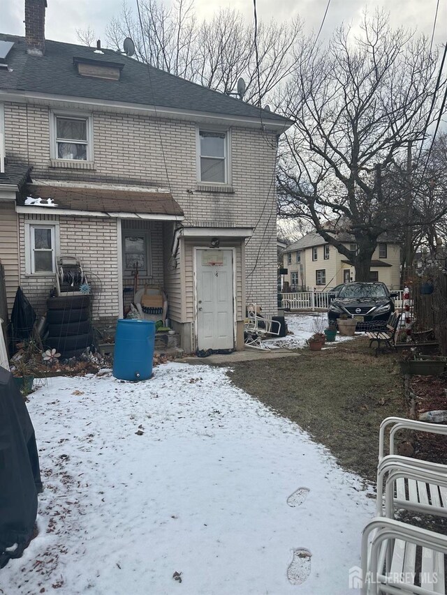 view of snow covered property