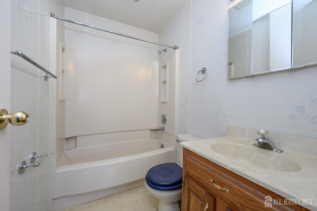 full bathroom featuring tile patterned floors, shower / bath combination, toilet, and vanity