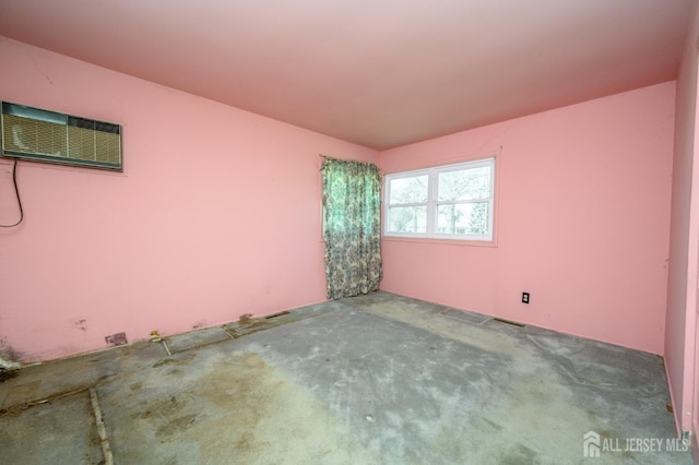 empty room featuring a wall mounted AC