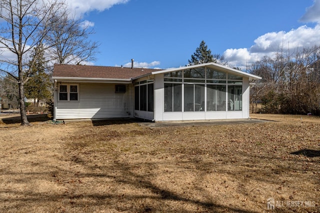 back of house with a sunroom