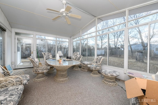 sunroom featuring lofted ceiling and ceiling fan