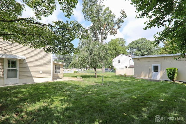 1270 S 9th St S, South Plainfield, NJ 07080 - view of grassy yard featuring a patio