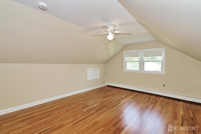 1270 S 9th St S, South Plainfield, NJ 07080 - additional living space featuring a baseboard radiator, wood finished floors, vaulted ceiling, and a ceiling fan