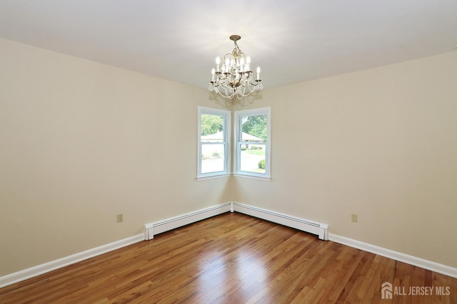 1270 S 9th St S, South Plainfield, NJ 07080 - spare room with a chandelier and wood finished floors