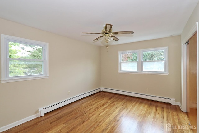 1270 S 9th St S, South Plainfield, NJ 07080 - unfurnished bedroom with light wood-style floors, a baseboard heating unit, and a ceiling fan