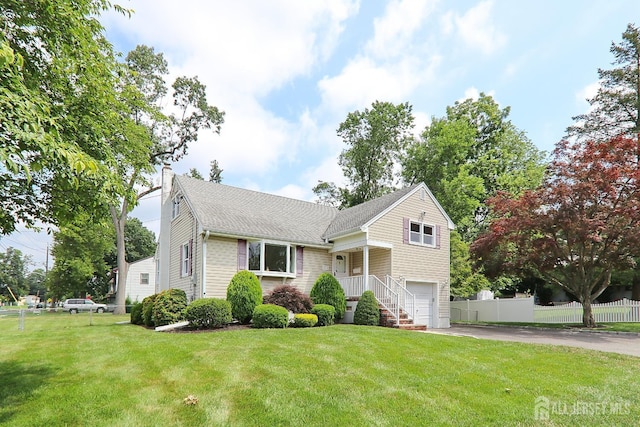 1270 S 9th St S, South Plainfield, NJ 07080 - tri-level home featuring a garage, driveway, and roof with shingles
