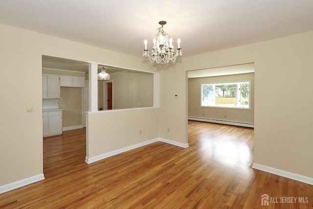 1270 S 9th St S, South Plainfield, NJ 07080 - unfurnished room featuring a chandelier, light wood-style floors, and baseboard heating