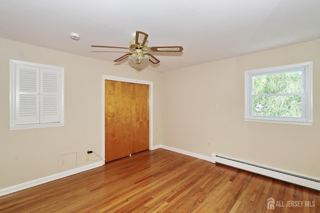1270 S 9th St S, South Plainfield, NJ 07080 - unfurnished room with light wood-style floors, baseboard heating, and a ceiling fan