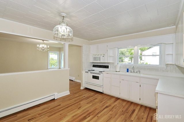 1270 S 9th St S, South Plainfield, NJ 07080 - kitchen with a chandelier, a baseboard radiator, white appliances, backsplash, and light wood-type flooring