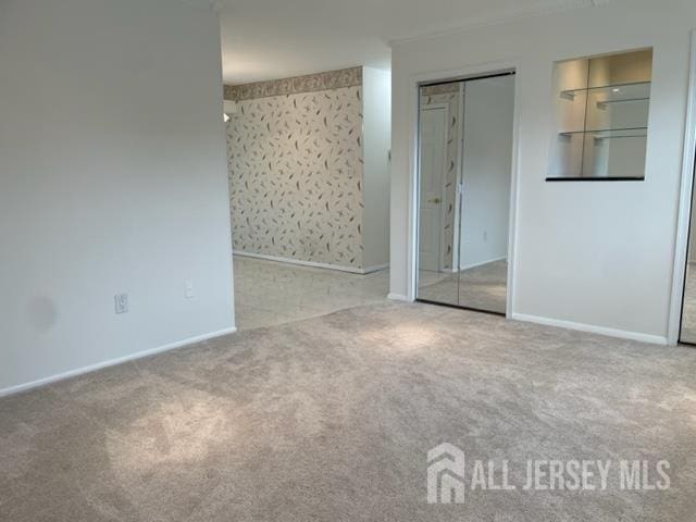 8 Indiana Ct Unit D, Old Bridge, NJ 07747 - unfurnished bedroom with carpet floors and baseboards