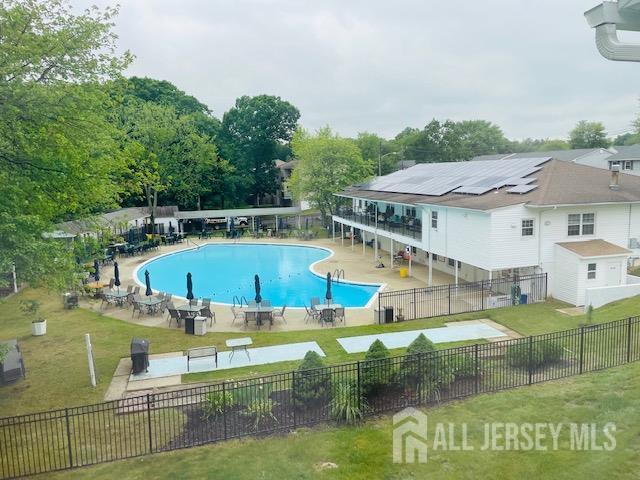 8 Indiana Ct Unit D, Old Bridge, NJ 07747 - community pool featuring a patio