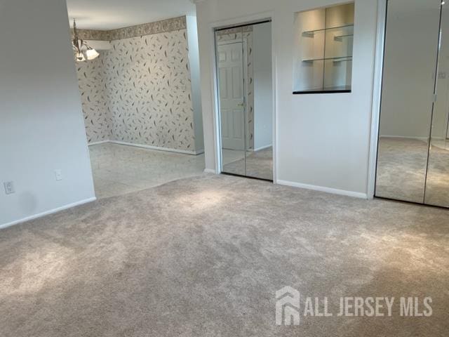 8 Indiana Ct Unit D, Old Bridge, NJ 07747 - unfurnished bedroom with carpet flooring and two closets