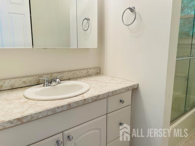 8 Indiana Ct Unit D, Old Bridge, NJ 07747 - full bath with vanity and shower / bath combination with glass door