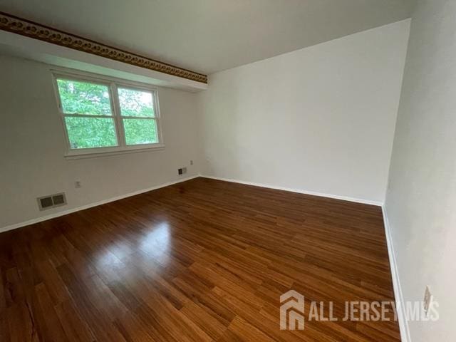 8 Indiana Ct Unit D, Old Bridge, NJ 07747 - empty room featuring wood finished floors and baseboards