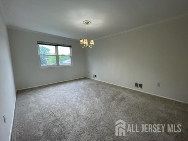 8 Indiana Ct Unit D, Old Bridge, NJ 07747 - carpeted spare room featuring a chandelier and ornamental molding