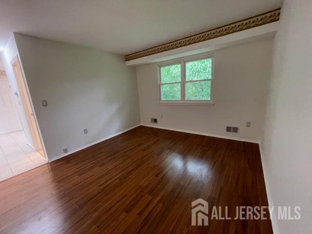 8 Indiana Ct Unit D, Old Bridge, NJ 07747 - unfurnished room featuring wood finished floors and baseboards
