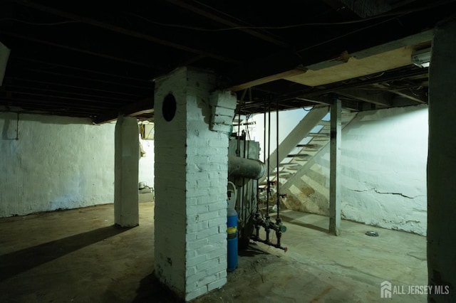unfinished below grade area featuring stairs