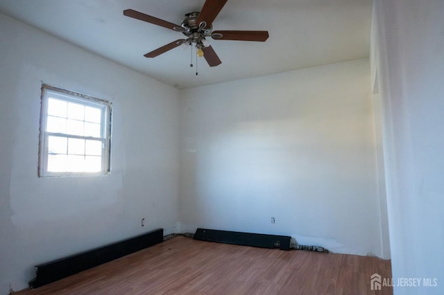 unfurnished room featuring wood finished floors and ceiling fan