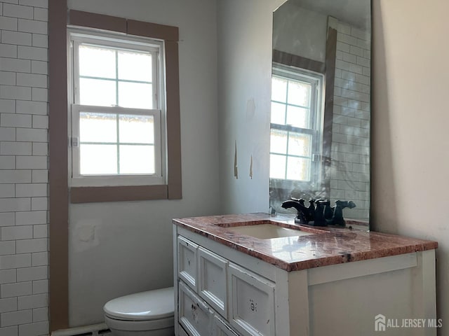 bathroom with vanity and toilet