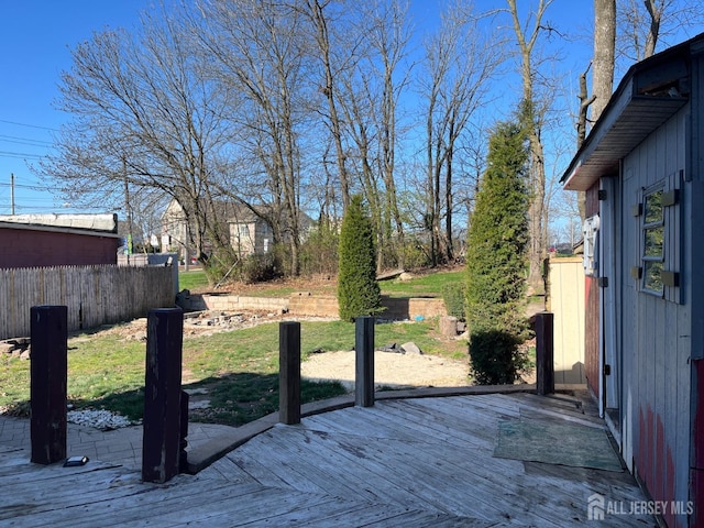 exterior space featuring fence and a deck
