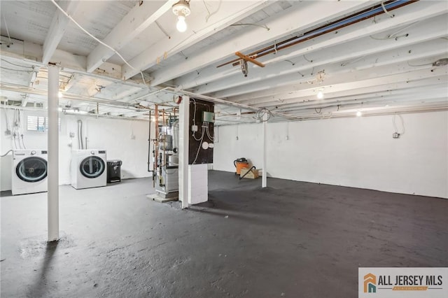 unfinished basement with washing machine and dryer