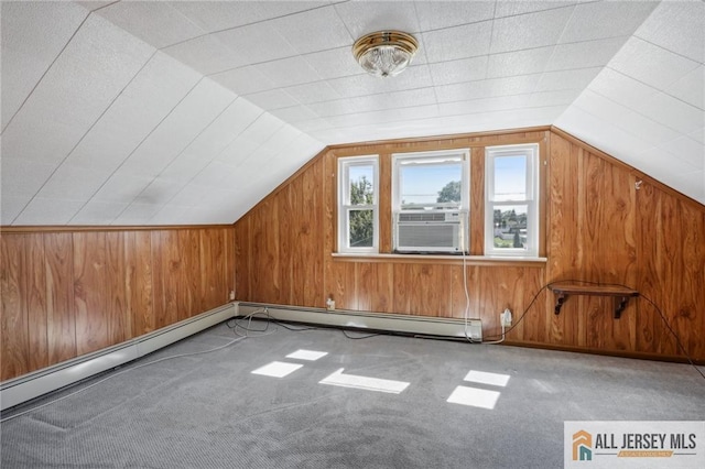 bonus room featuring wooden walls, cooling unit, carpet, and vaulted ceiling