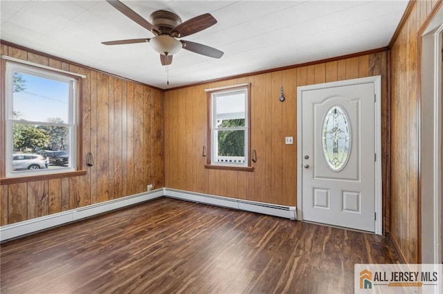 entrance foyer with dark wood-type flooring, a ceiling fan, and baseboard heating