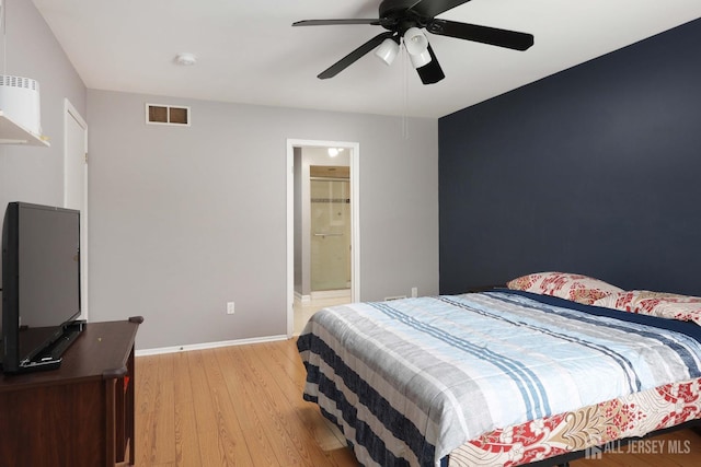 bedroom featuring visible vents, light wood-style flooring, baseboards, and ceiling fan