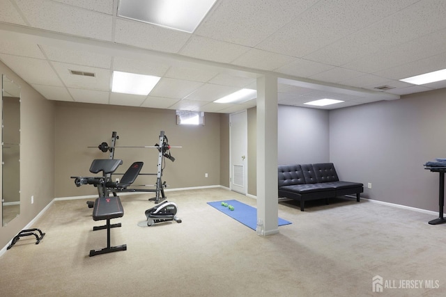 exercise room featuring visible vents and baseboards