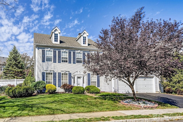 419 Perry St, Morganville, NJ 07751 - colonial home featuring asphalt driveway and a garage