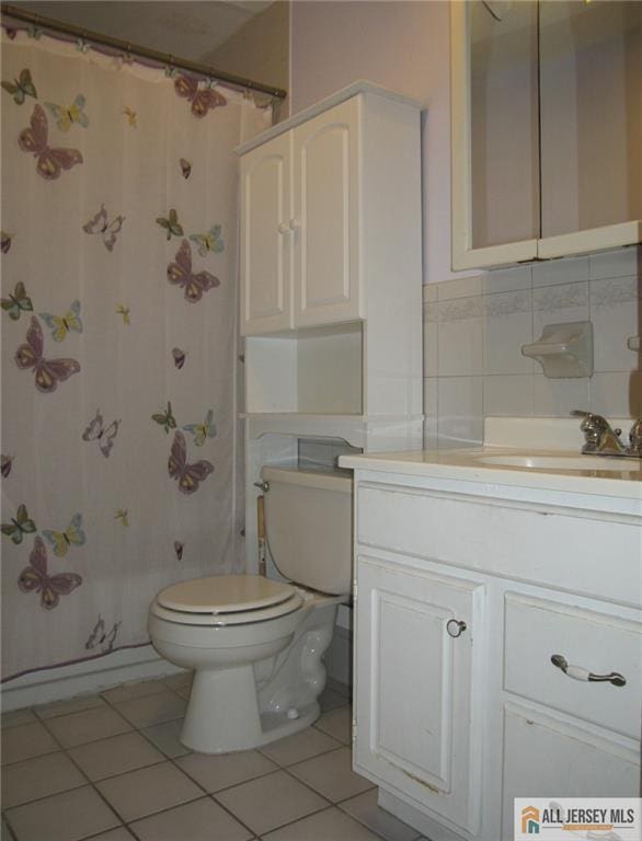 903 N Oaks Blvd, North Brunswick, NJ 08902 - full bathroom featuring tile patterned flooring, vanity, a shower with shower curtain, and tile walls