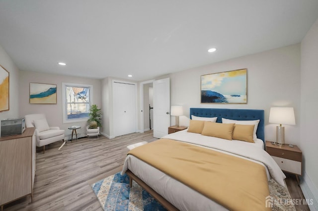 bedroom featuring light wood-type flooring, baseboards, and recessed lighting