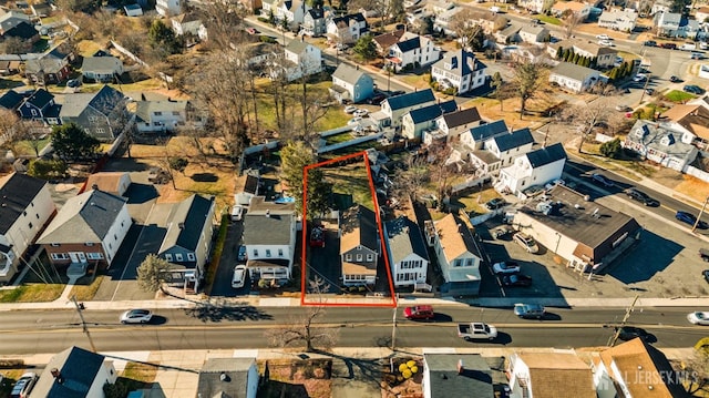 birds eye view of property with a residential view