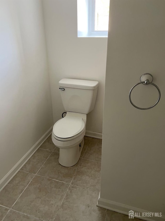 24 Kensington Ave, Old Bridge, NJ 08857 - bathroom featuring toilet, baseboards, and tile patterned flooring