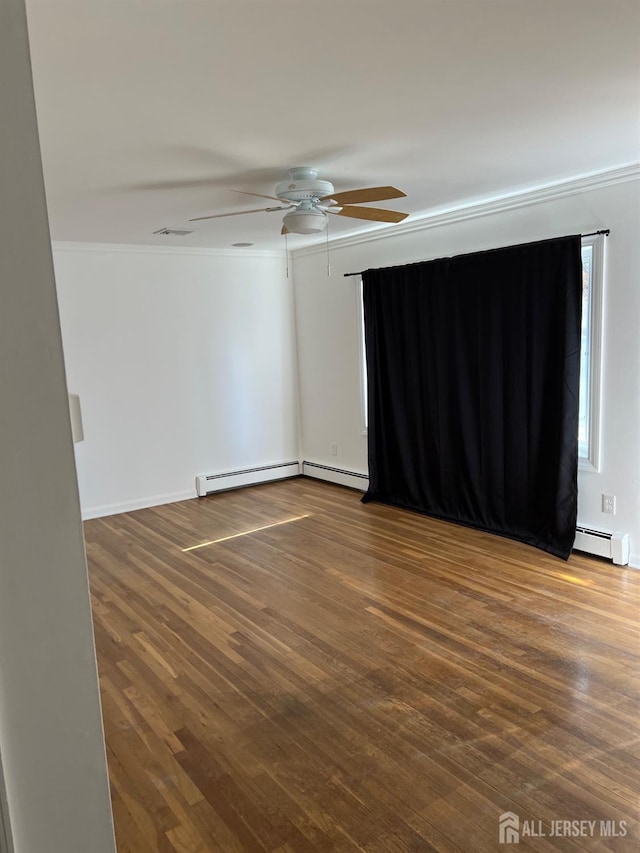 unfurnished room featuring baseboard heating, crown molding, hardwood / wood-style flooring, and ceiling fan