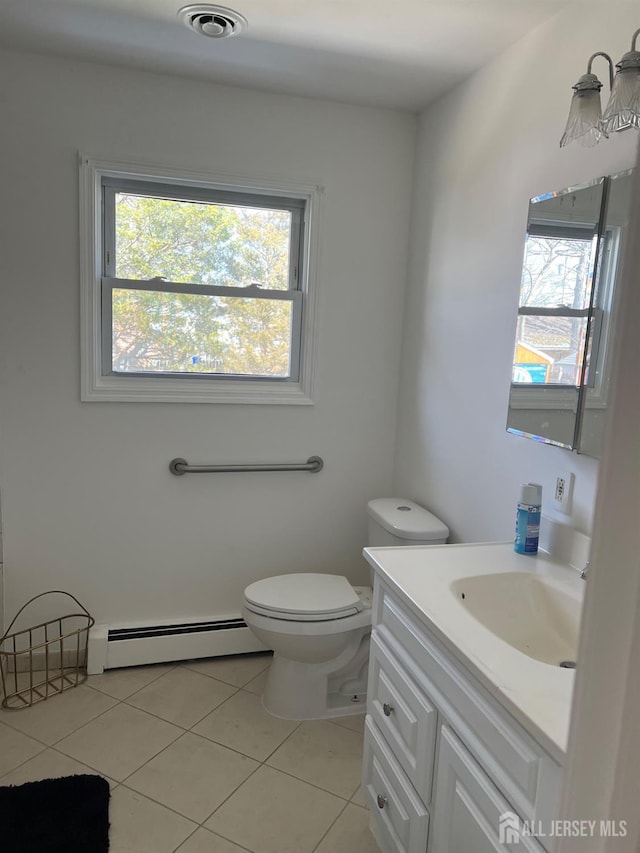 24 Kensington Ave, Old Bridge, NJ 08857 - bathroom featuring a baseboard heating unit, vanity, tile patterned floors, and toilet