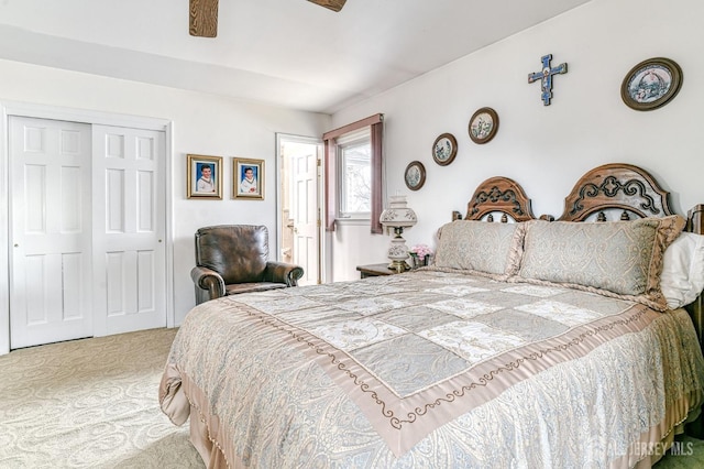 carpeted bedroom with a closet and ceiling fan