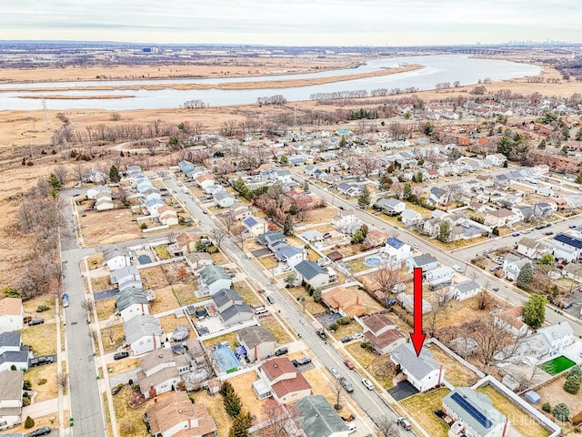 bird's eye view featuring a residential view and a water view