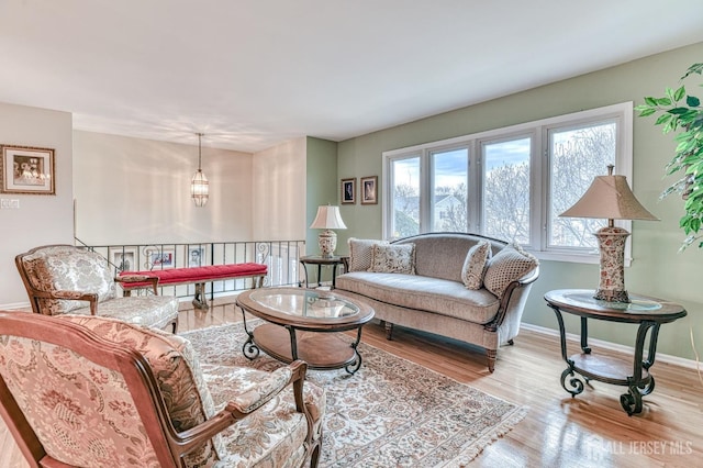 living room featuring wood finished floors and baseboards