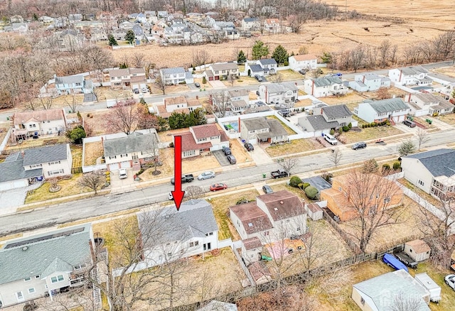 birds eye view of property with a residential view