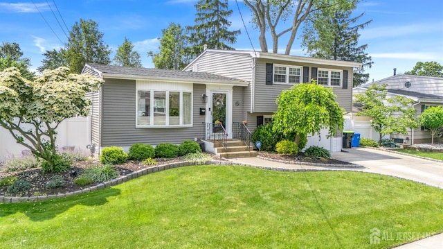 27 York St, Old Bridge, NJ 08857 - split level home featuring driveway and a garage