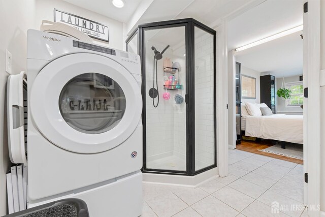 27 York St, Old Bridge, NJ 08857 - laundry room featuring washer / dryer and light tile patterned flooring