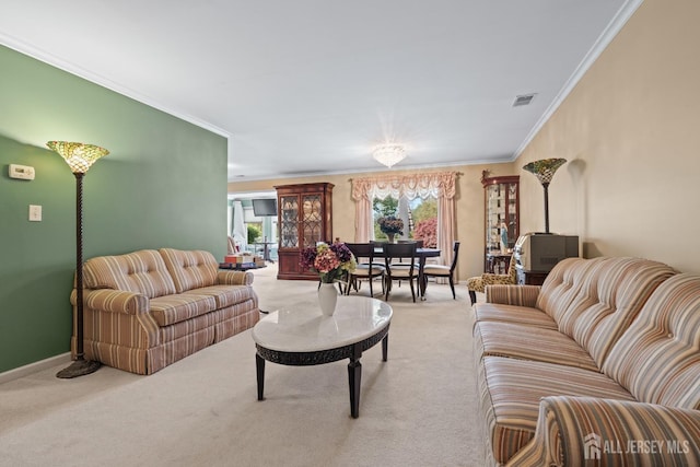 carpeted living area with ornamental molding and baseboards
