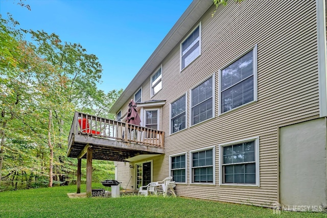 37 Walden Ct, Old Bridge, NJ 08857 - rear view of house featuring a wooden deck and a lawn