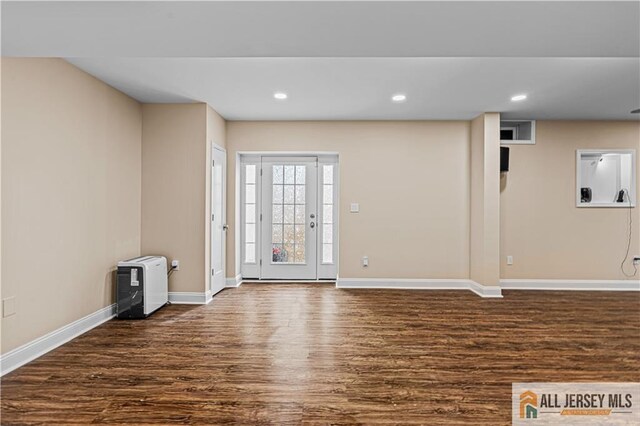 153 Scarborough Rd, Montgomery, NJ 08502 - unfurnished living room featuring dark wood-type flooring, baseboards, and recessed lighting