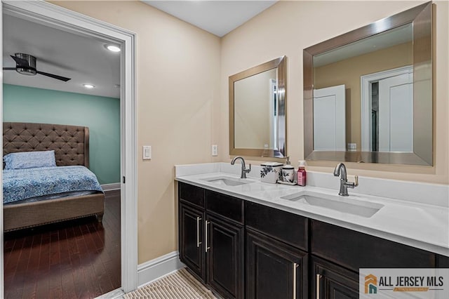 153 Scarborough Rd, Montgomery, NJ 08502 - ensuite bathroom featuring double vanity, baseboards, wood finished floors, and a ceiling fan