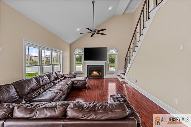 153 Scarborough Rd, Montgomery, NJ 08502 - living room featuring hardwood / wood-style floors, stairway, a lit fireplace, ceiling fan, and baseboards