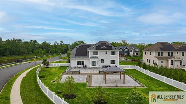 153 Scarborough Rd, Montgomery, NJ 08502 - rear view of house with a gazebo, a patio, and roof mounted solar panels